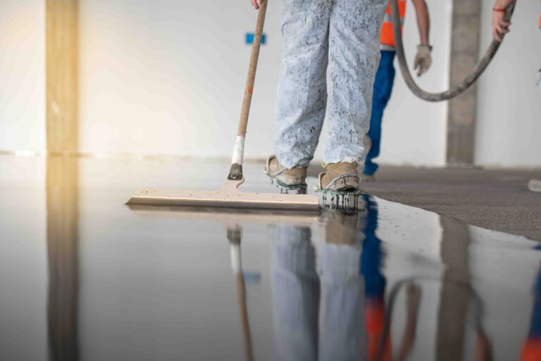 The people cleaning floor with machine.